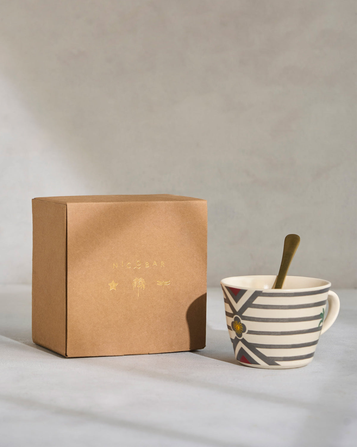 Leafty Affair Soup Mug with Spoon beside its kraft gift box.