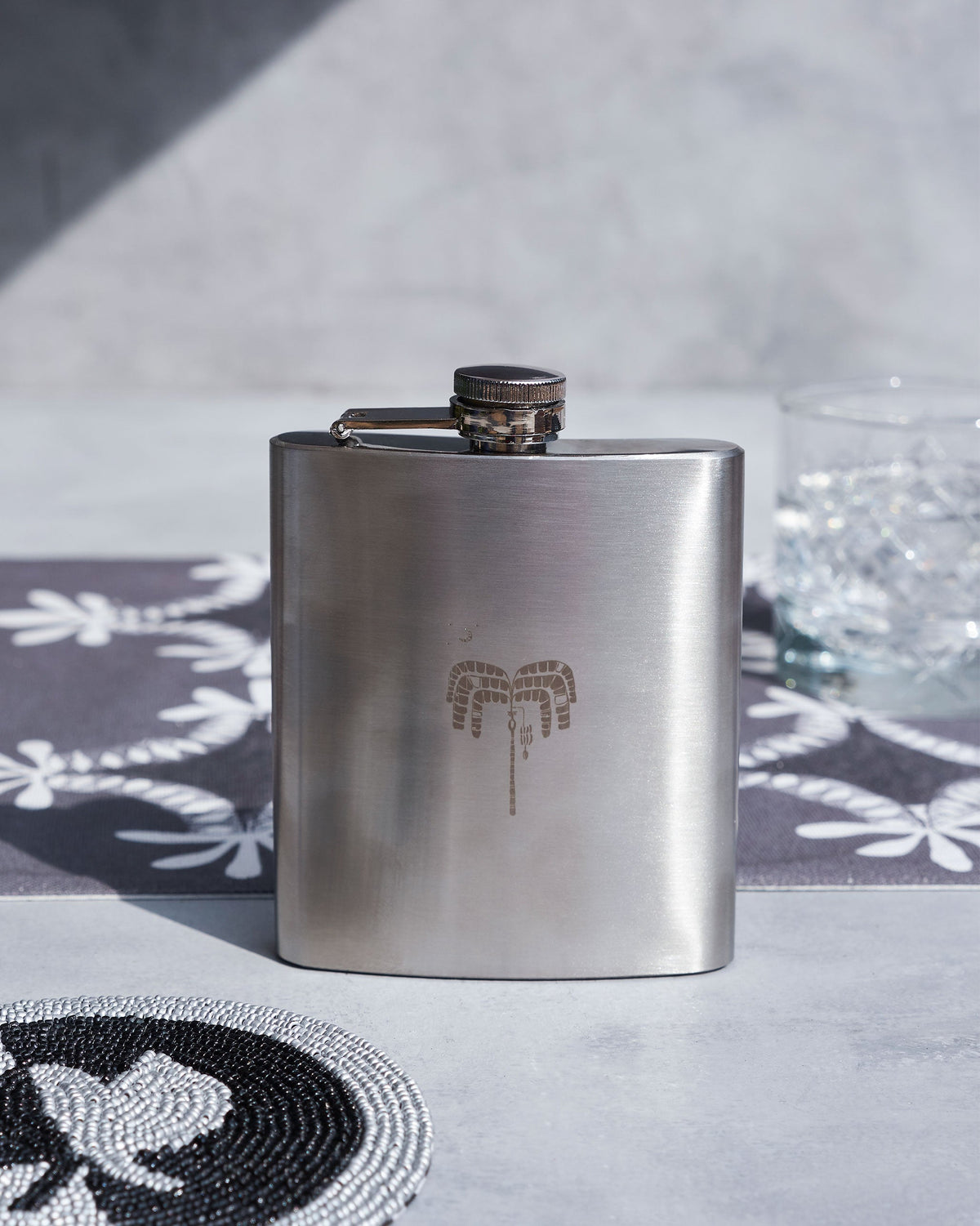 Safari Flask with an engraved motif on its front face.
