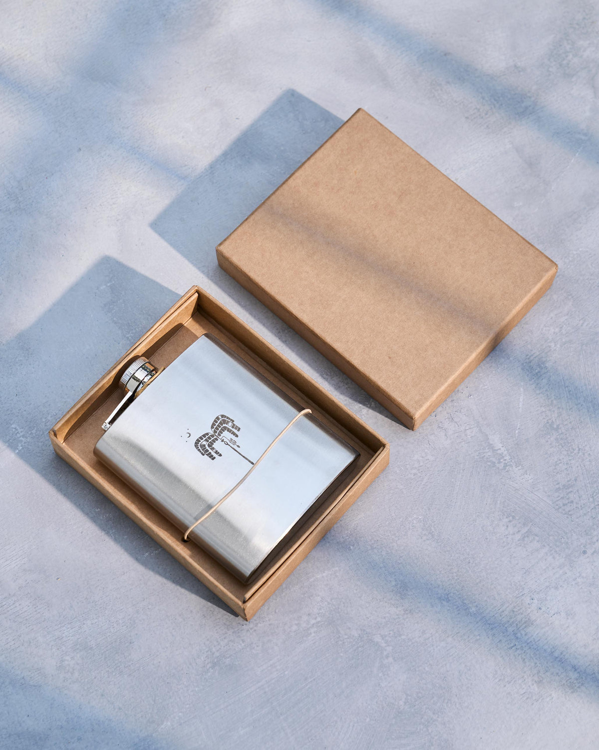 Safari Flask in an open brown gift box.