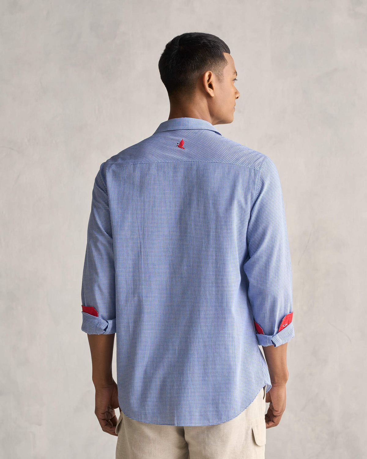 Back of the Bias Placket Shirt worn by a person, in blue checks.