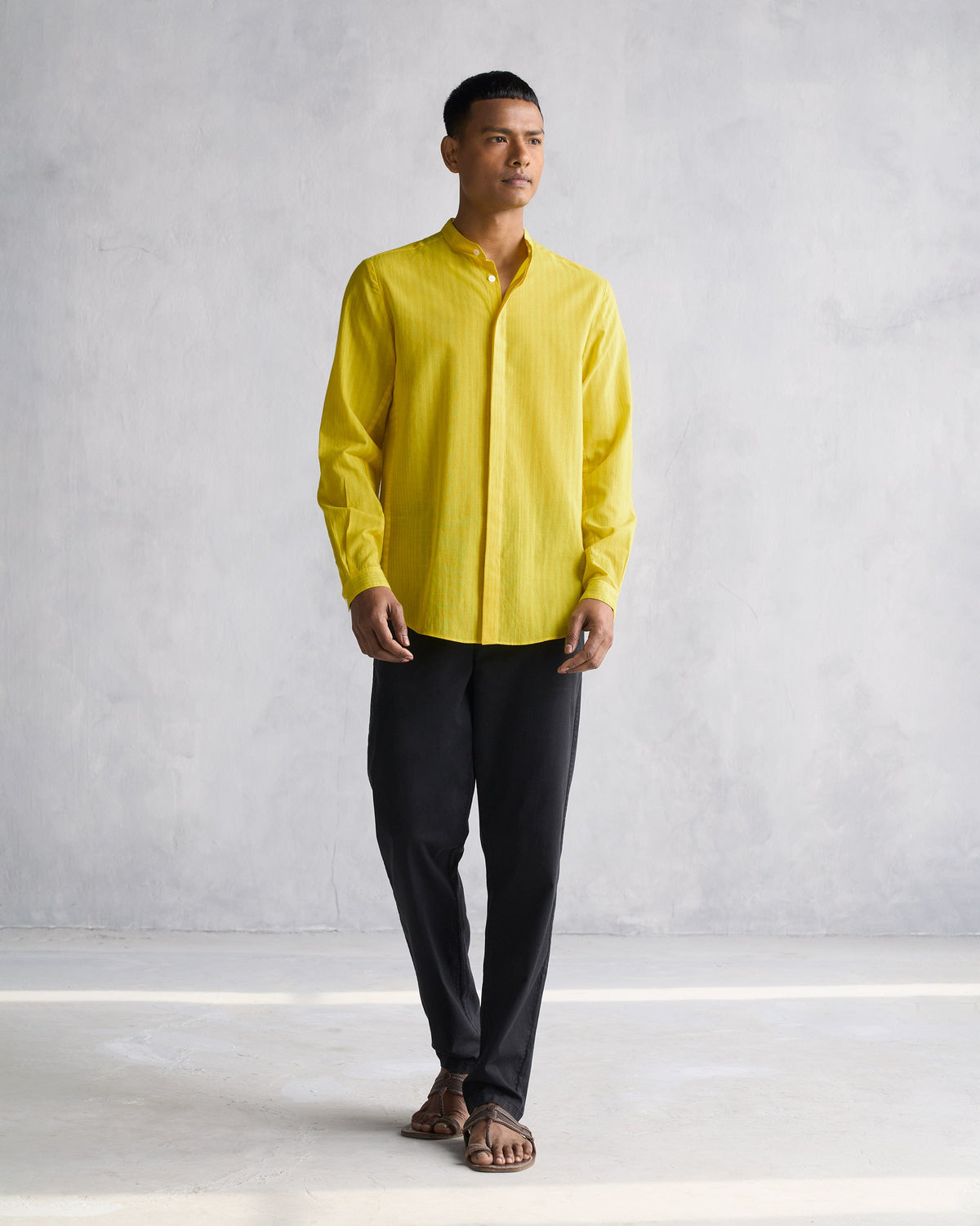 Full-length view of a yellow Side Placket shirt worn by a person.