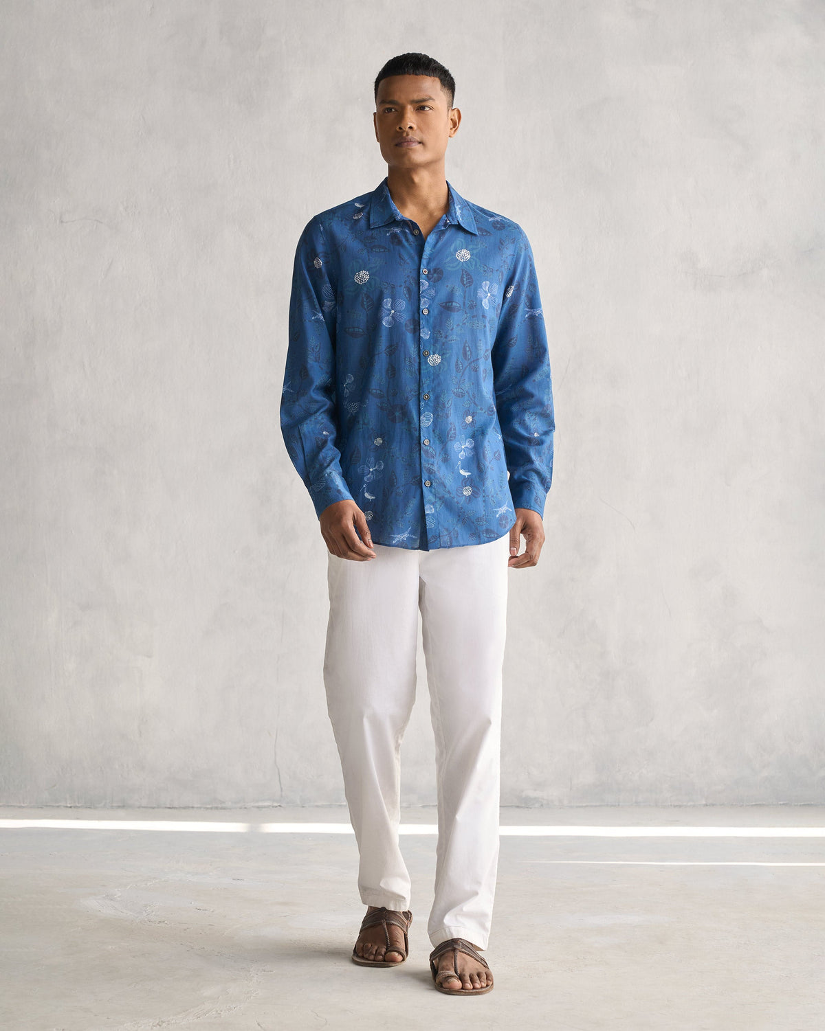 Full-length view of a navy Hakuna Shirt worn by a person.