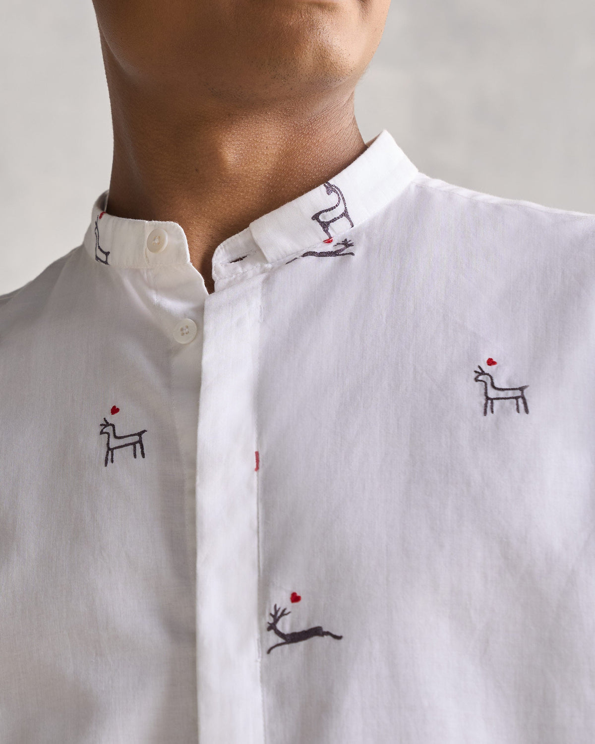 Close-up of the Classic Band Collar Shirt showing its band collar and deer motifs.