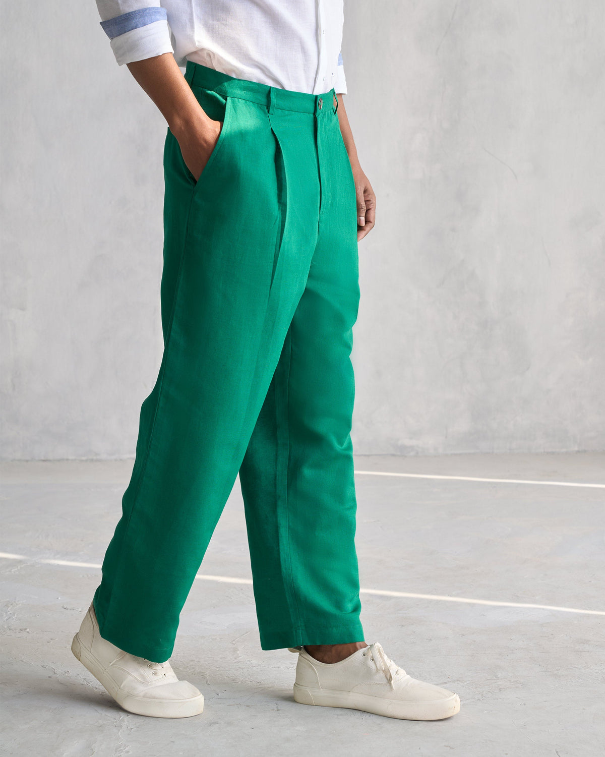 Side view of green Pleated Pants worn by a person.