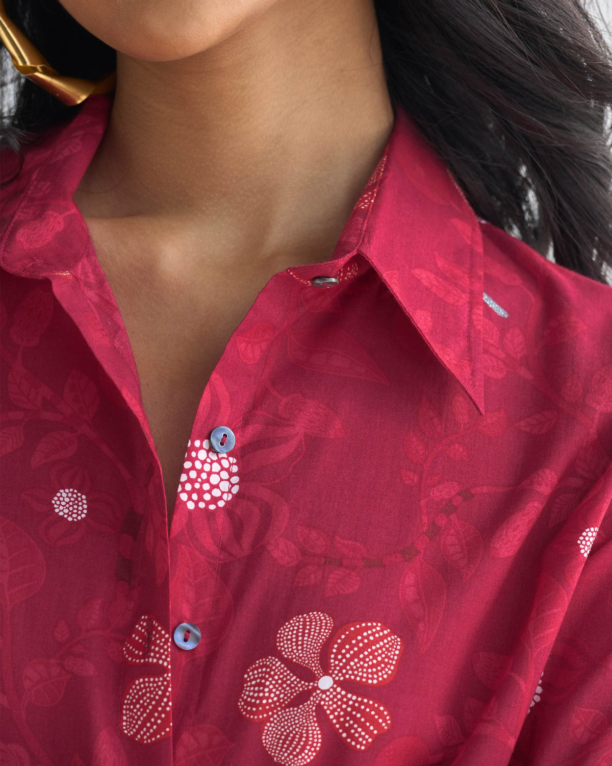 Close-up of the Tropico Shirt front placket showing blue buttons and a floral print.