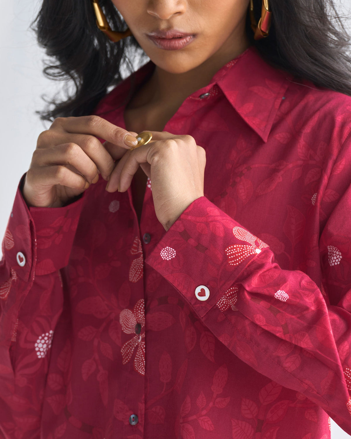 Close-up of the Tropico Shirt cuff showing a red heart button.