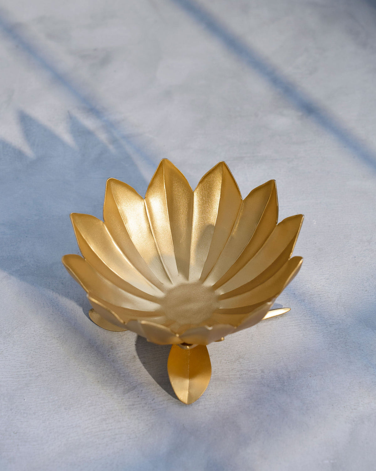 Overhead view of the Bloom Deco Bowl showing its gold petals.