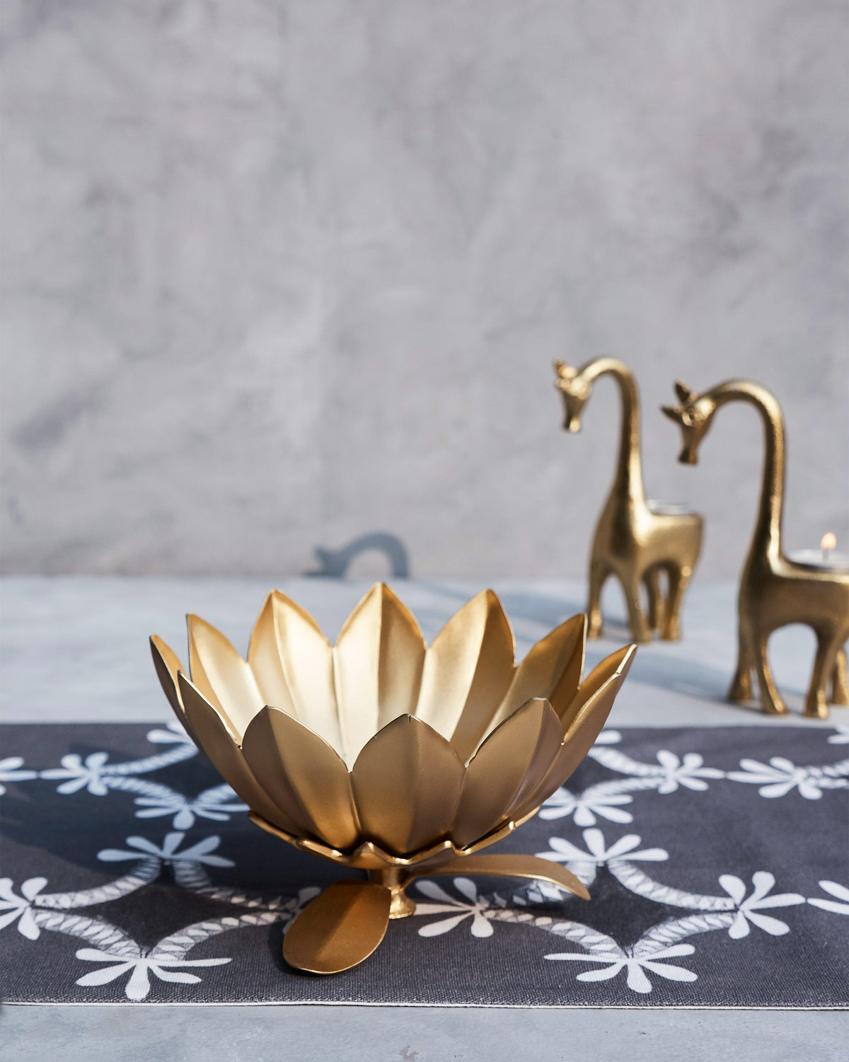 Bloom Deco Bowl on a patterned table runner.