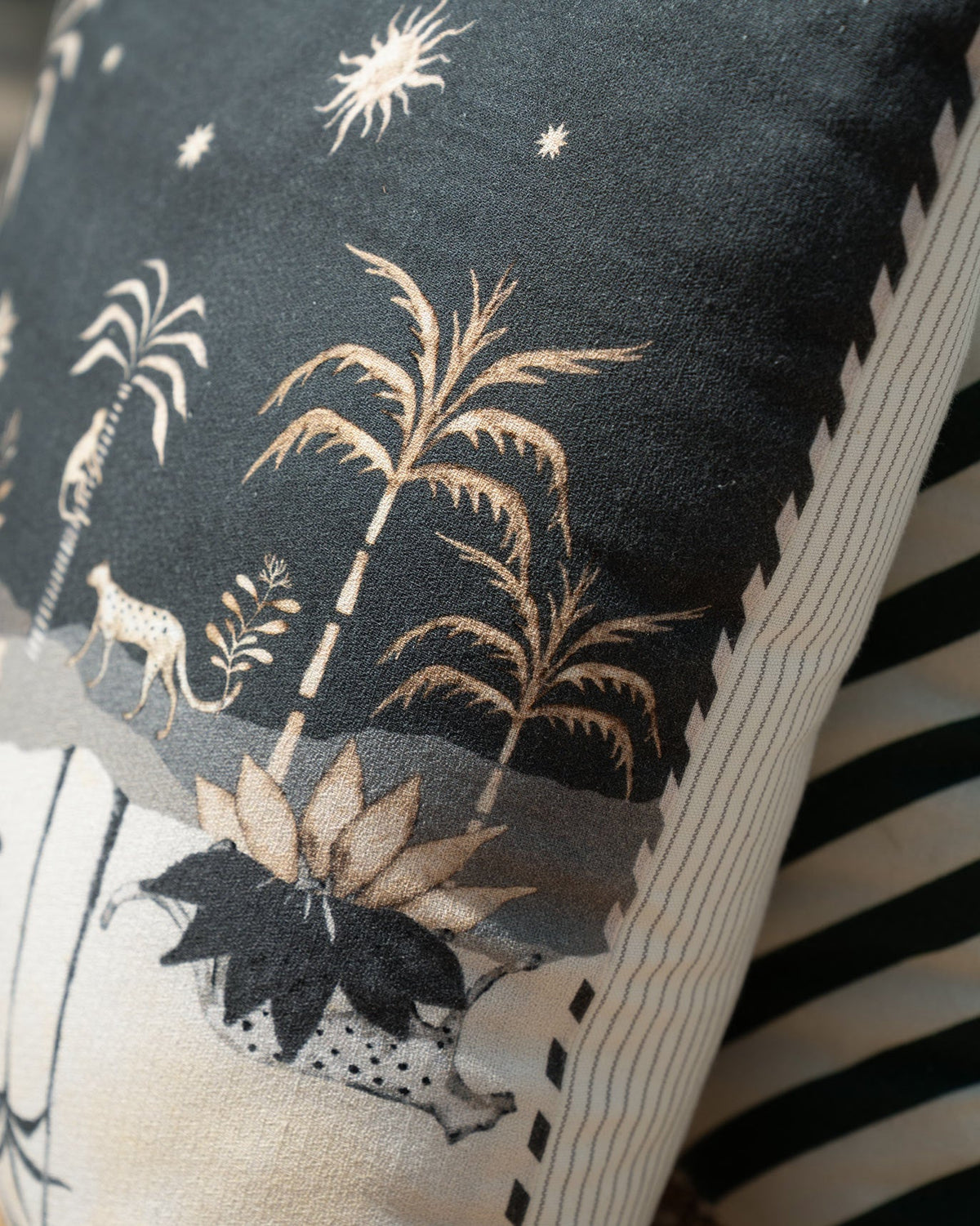 Close-up of the Twilight Jungle Cushion Cover showing palm trees and a leopard.