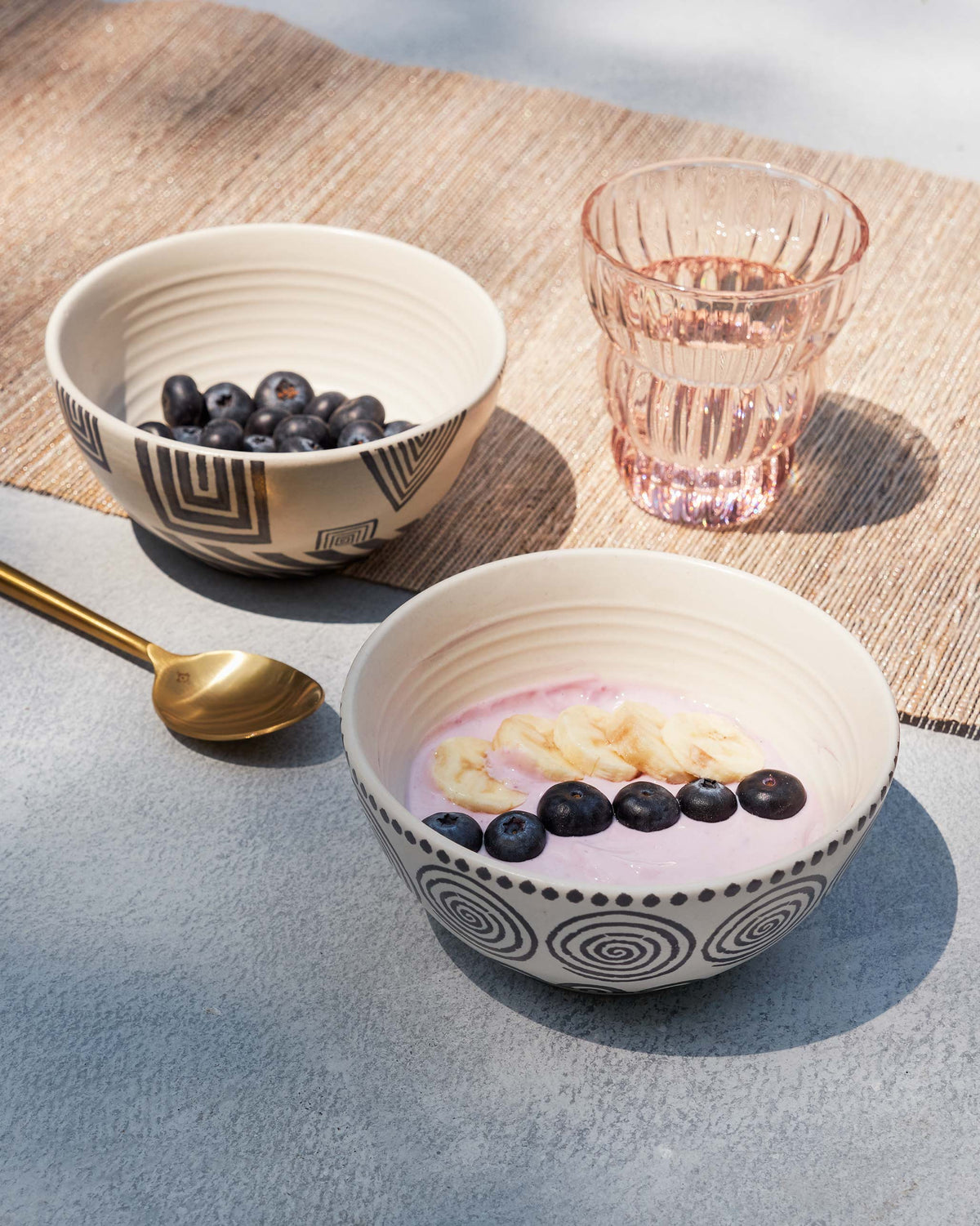 Serenity cereal bowl with yoghurt and blueberries, with a second bowl at the back.