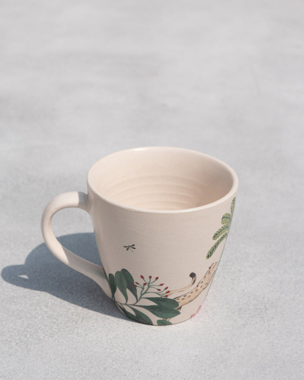 Side view of a Zanzibar Conical Mug with a loop handle.