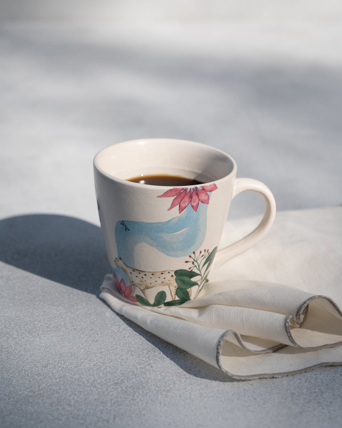 Zanzibar Conical Mug filled with coffee.