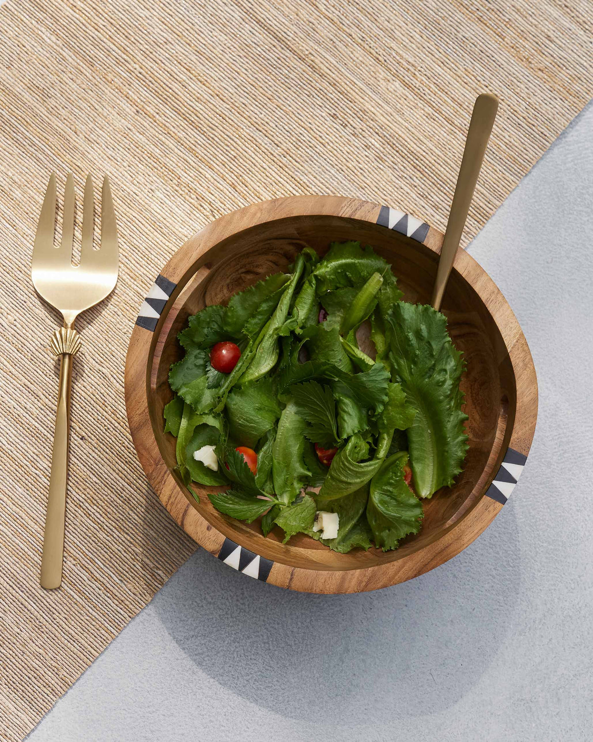 Overhead view of a Zanzibar Salad Bowl filled with leafy greens.