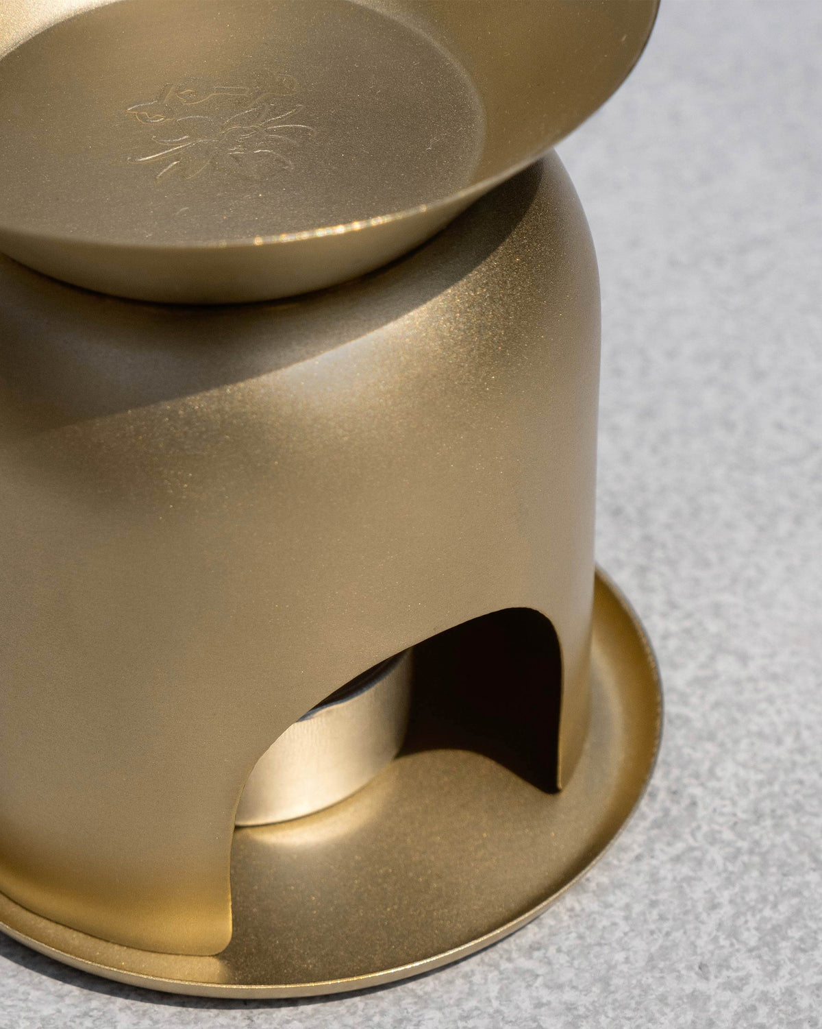 Close-up of the gold Clove Diffuser dish and tealight opening.