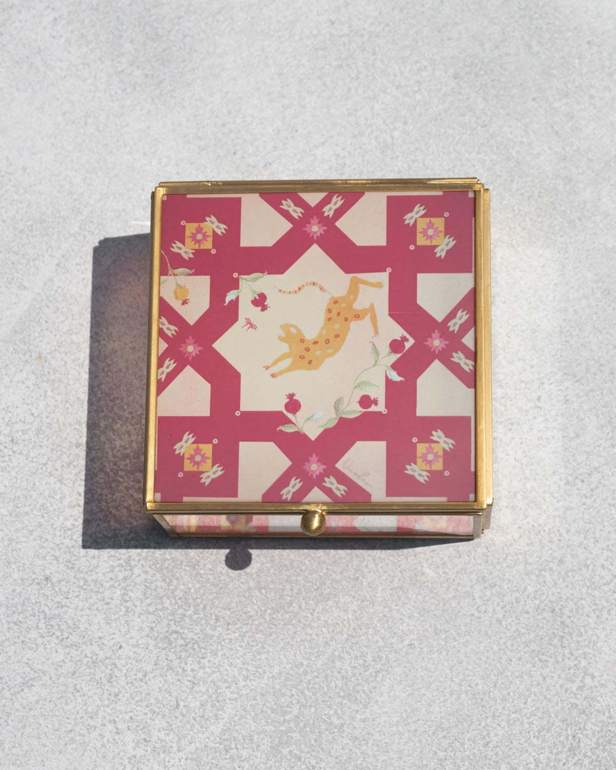 Overhead view of the closed Leopard Jewellery Box with a pink patterned lid.