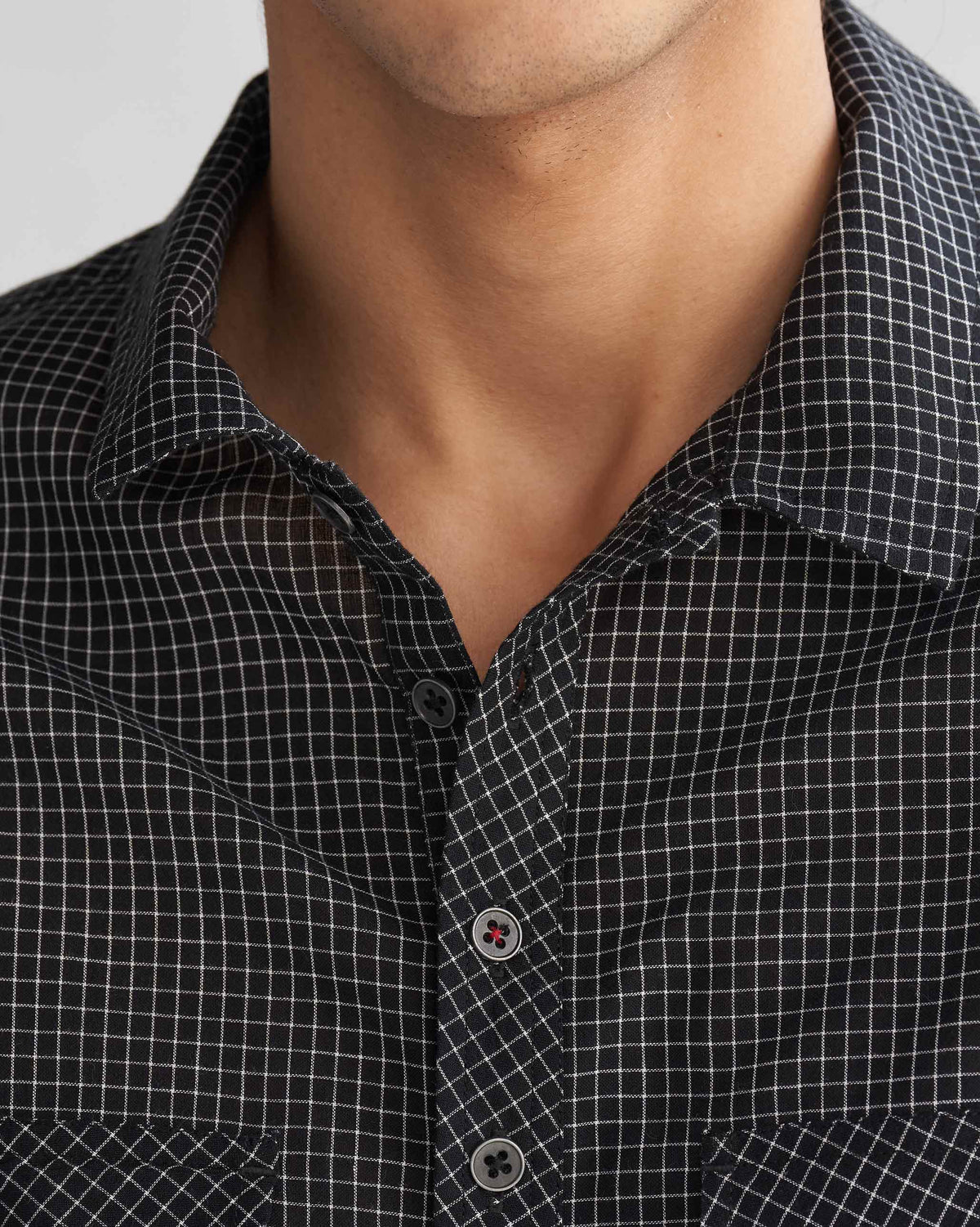 Close-up of the Big Pocket shirt collar and placket, with its buttons.