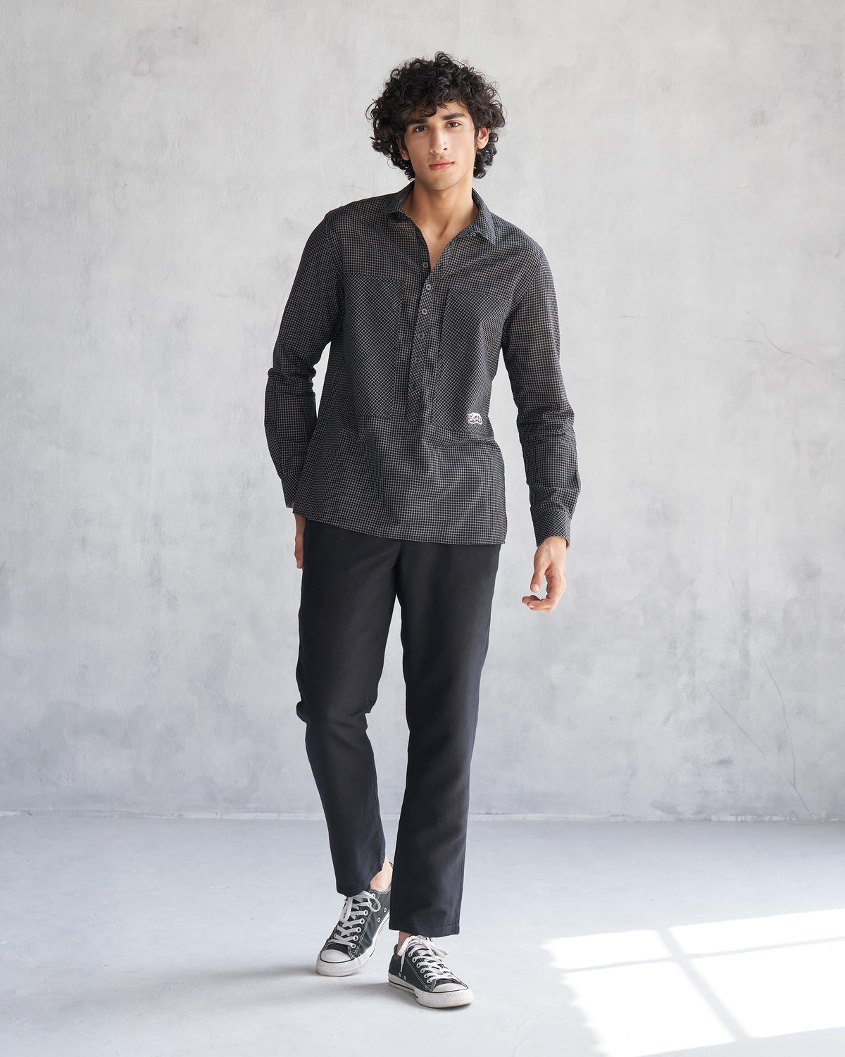 Person wearing the Big Pocket shirt, shown full length.