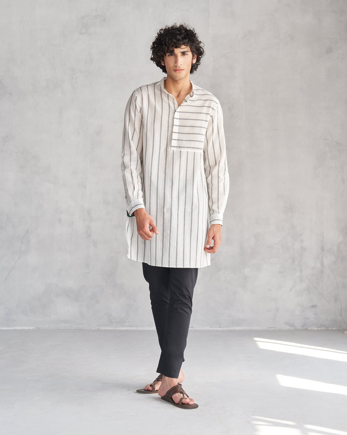 Person wearing a full-length ivory and black Panel Stripe Kurta.
