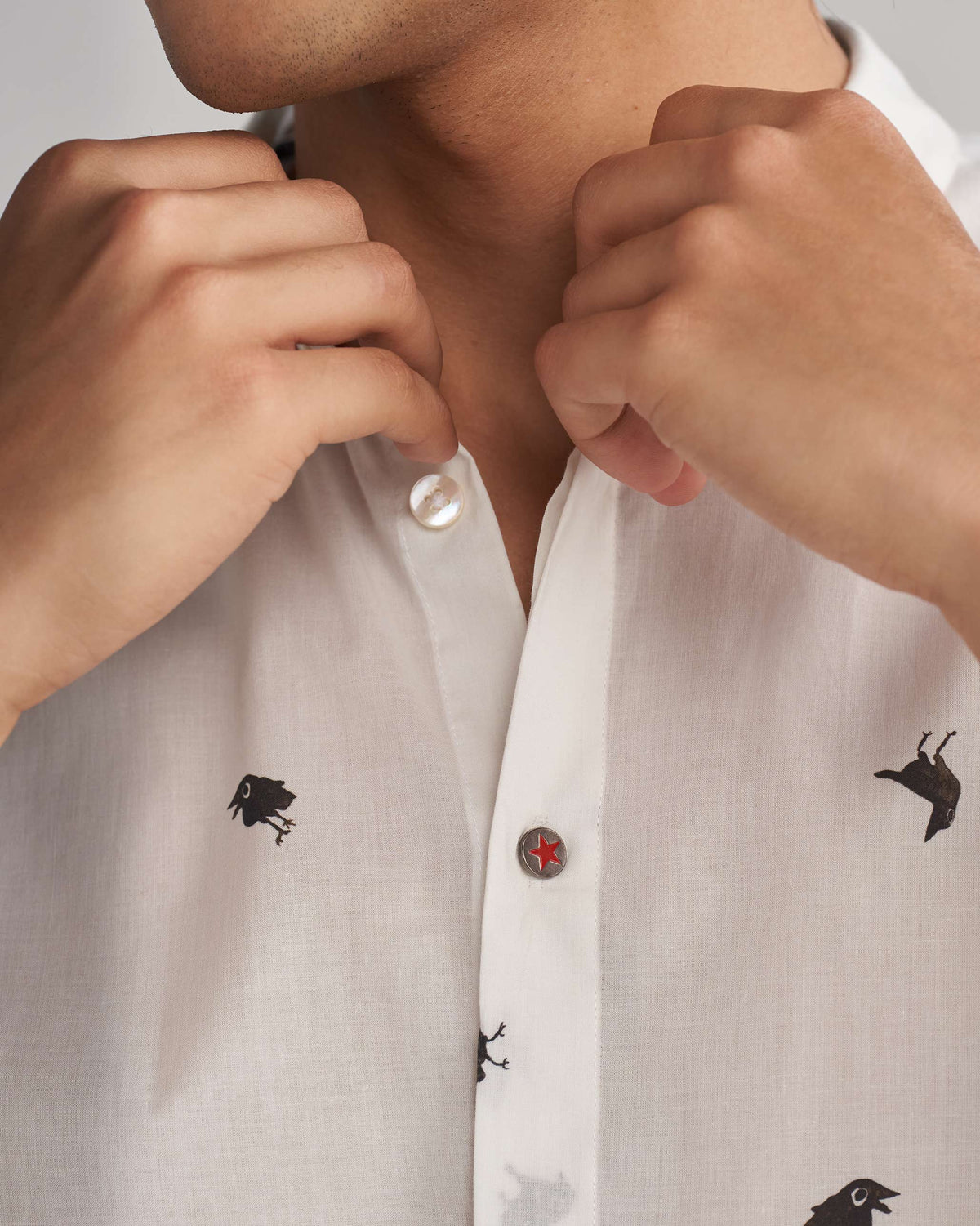 Close-up of the Riverine Shirt's placket, showing a red star button.