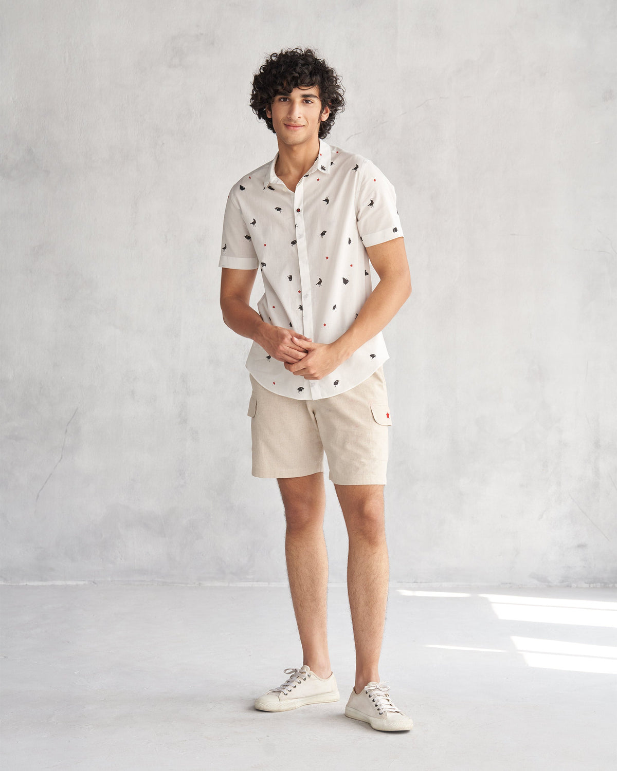 Full-length view of a person wearing the Riverine Shirt in white.