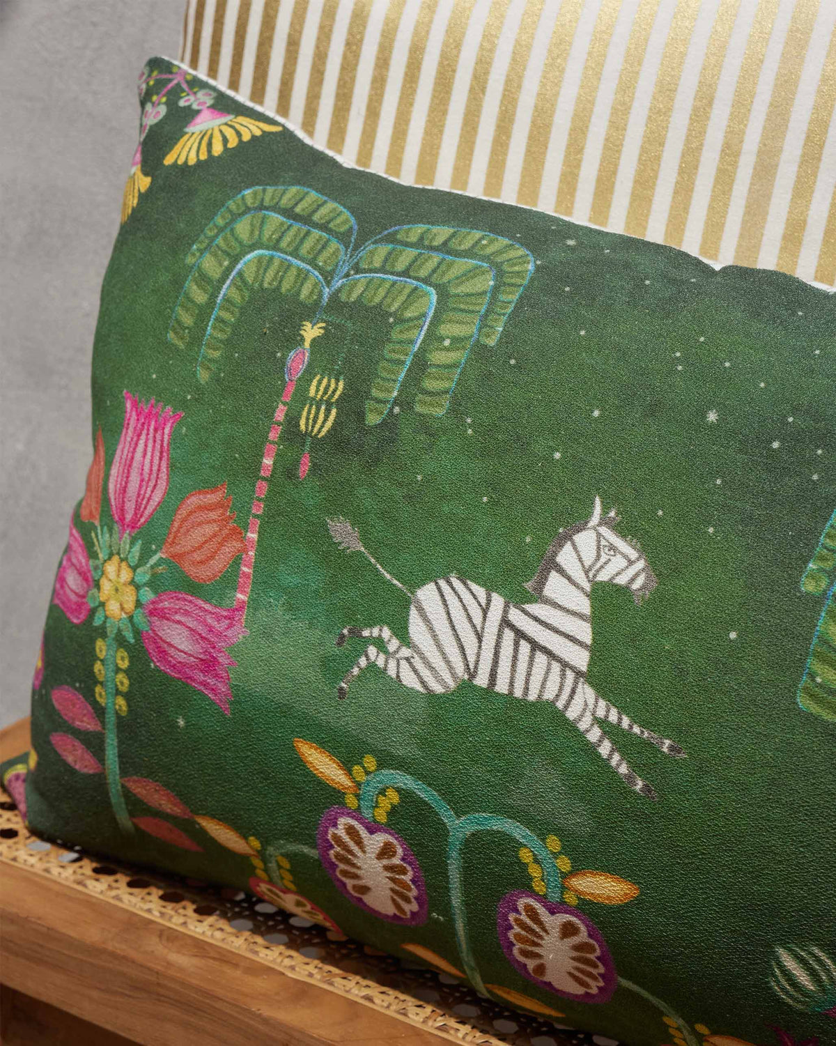Close-up of Amani Lumbar Cushion Cover showing a zebra and pink flowers.