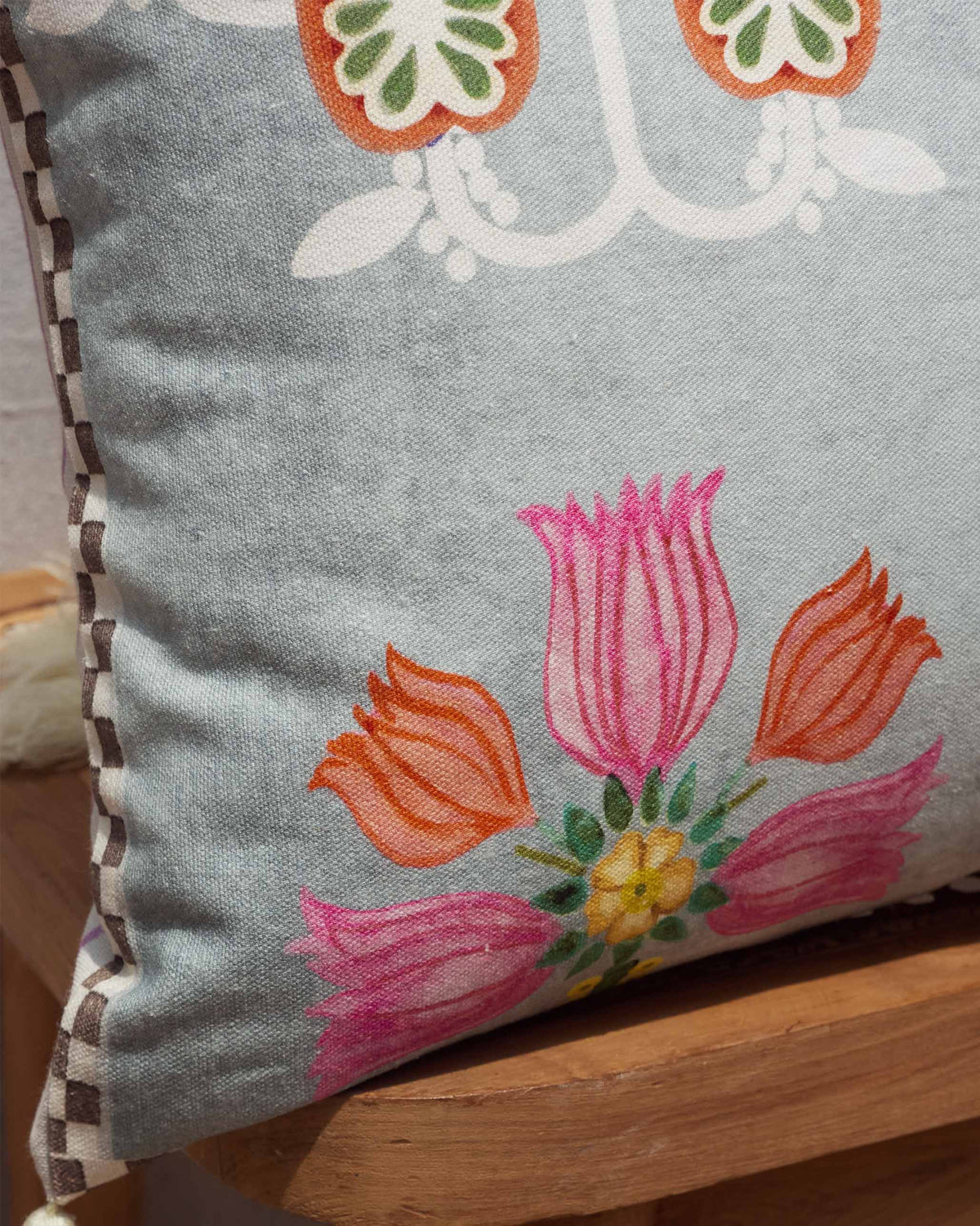 Close-up of Bahari Lumbar Cushion Cover showing pink and orange tulip motifs.