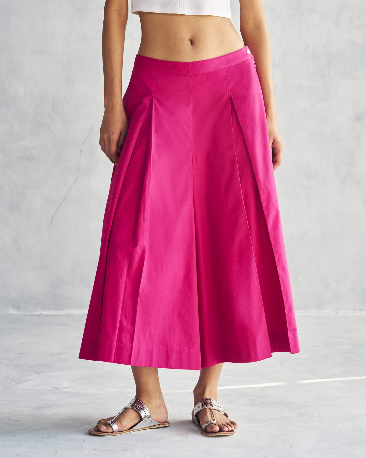 Person wearing Pleated Flare Culottes in berry with pleats down the front.