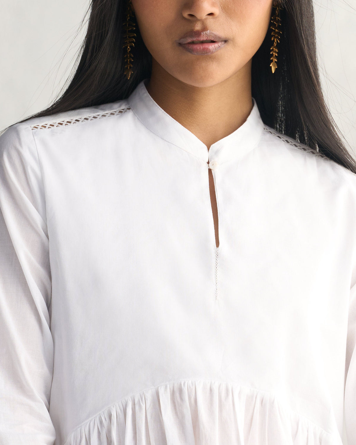 Close-up of the white Waist Gathered Kurta neckline with a keyhole placket and shoulder lattice.