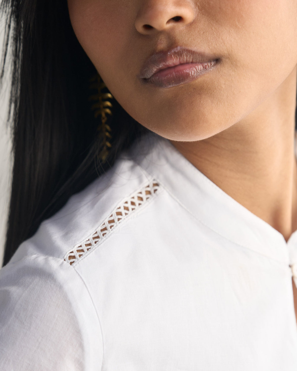 Close-up of the white Waist Gathered Kurta shoulder showing lattice cutwork.