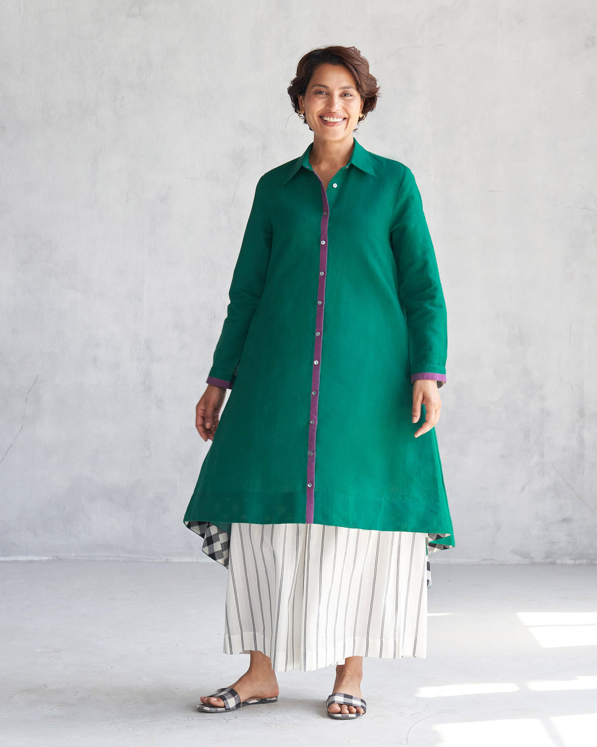 Person wearing a green Midori High Low Kurta with a flared A-line shape.
