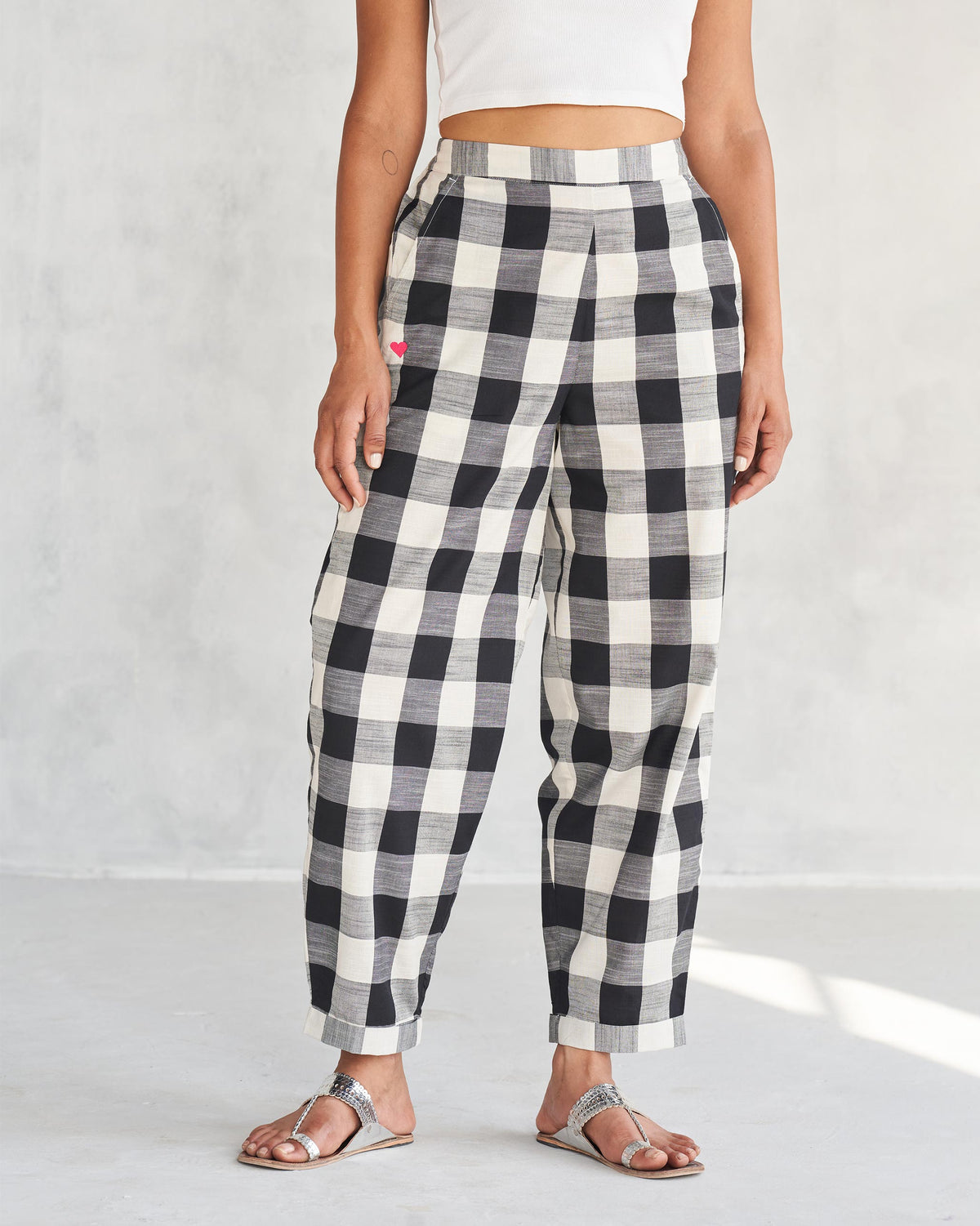 Person wearing black and ivory Midori Pants.