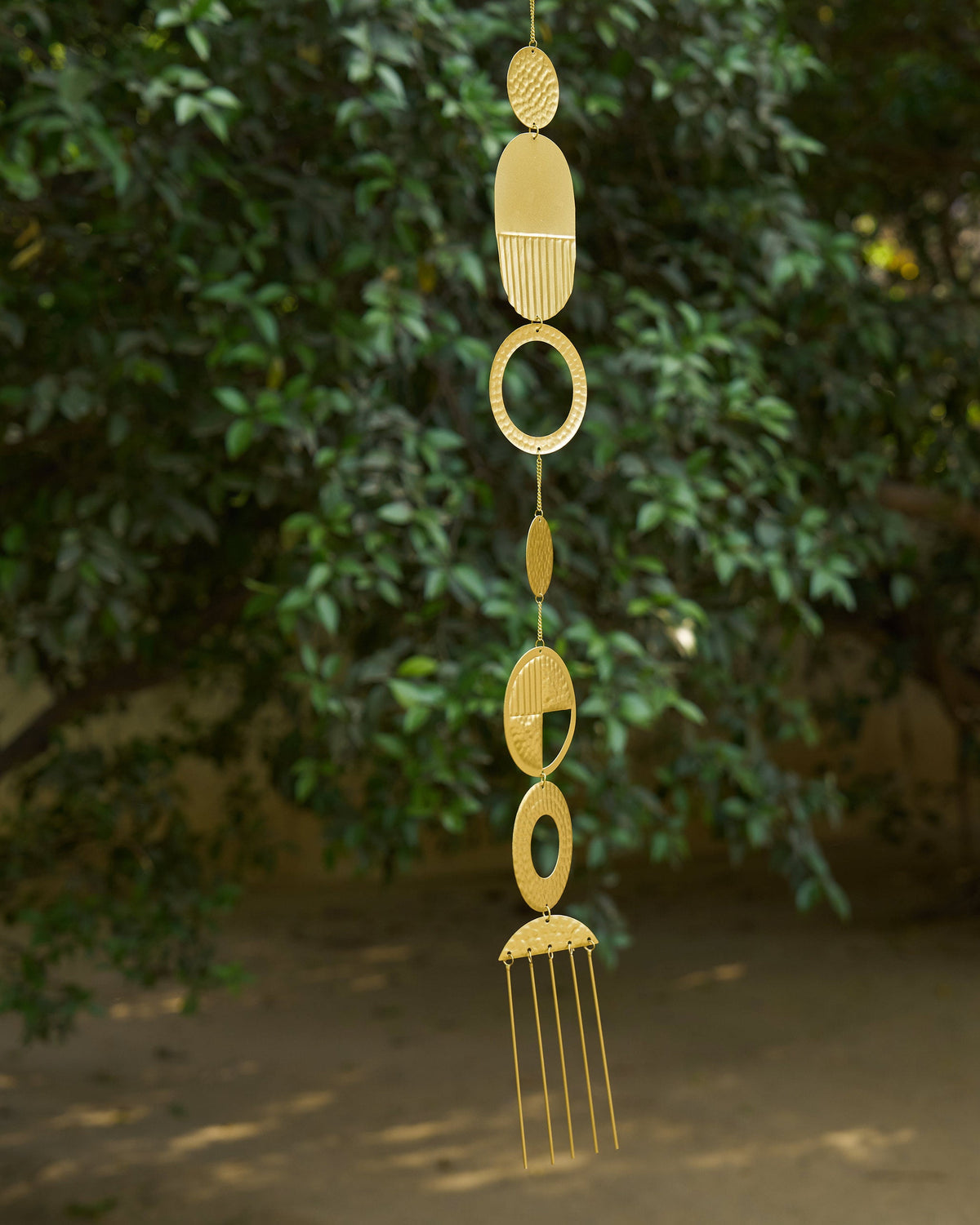 Full view of a Celestial Toran showing its stacked discs and rods.