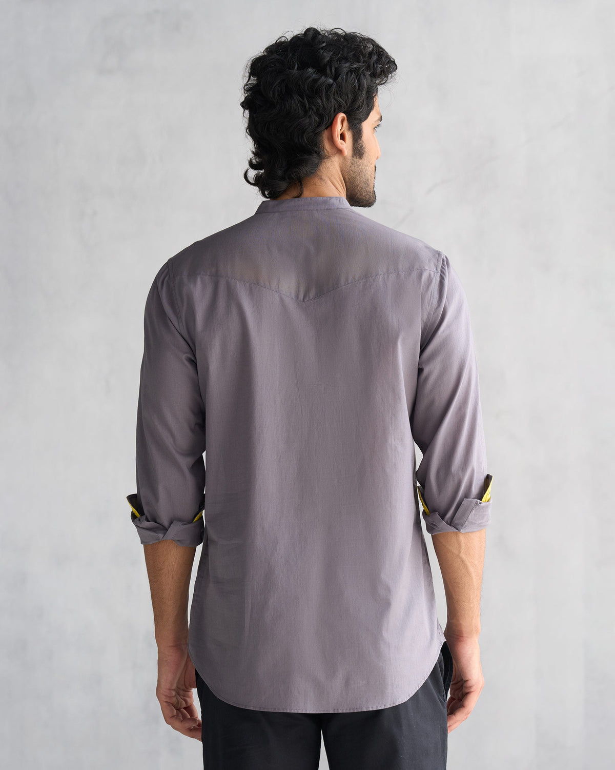 Back of the Pondicherry Shirt worn by a person, in charcoal.