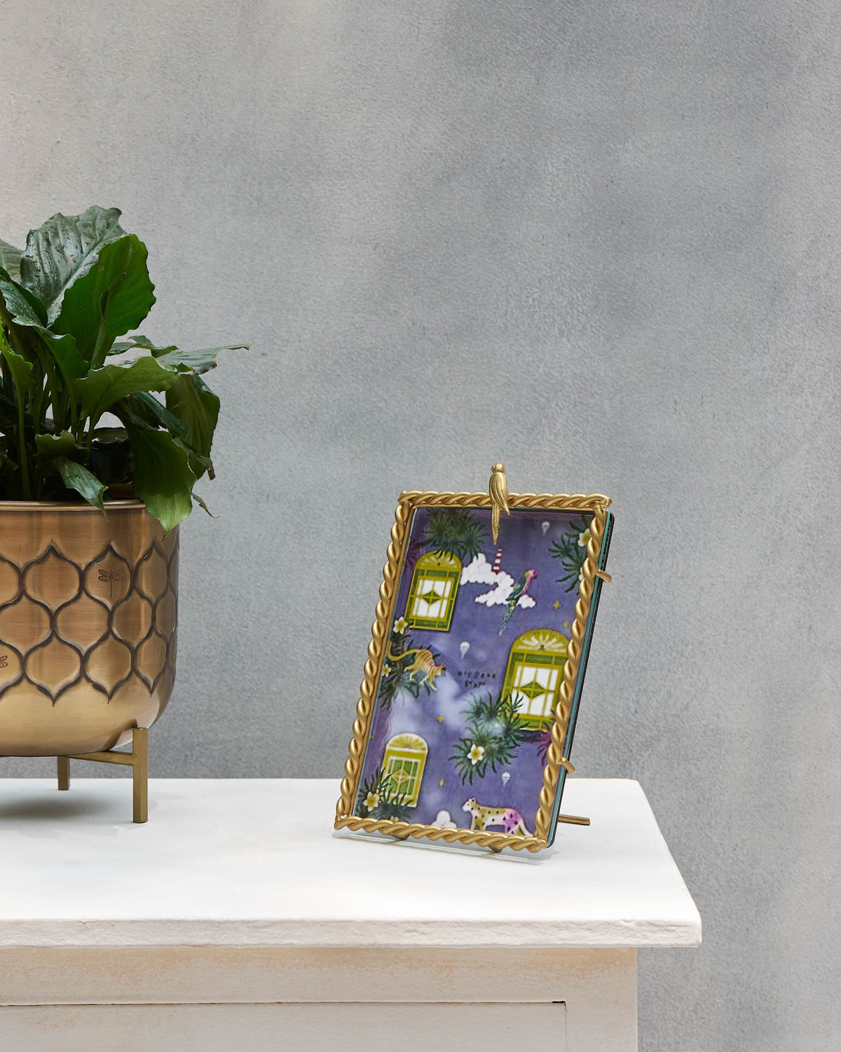 Zanzibar Photo frame standing on a white shelf.