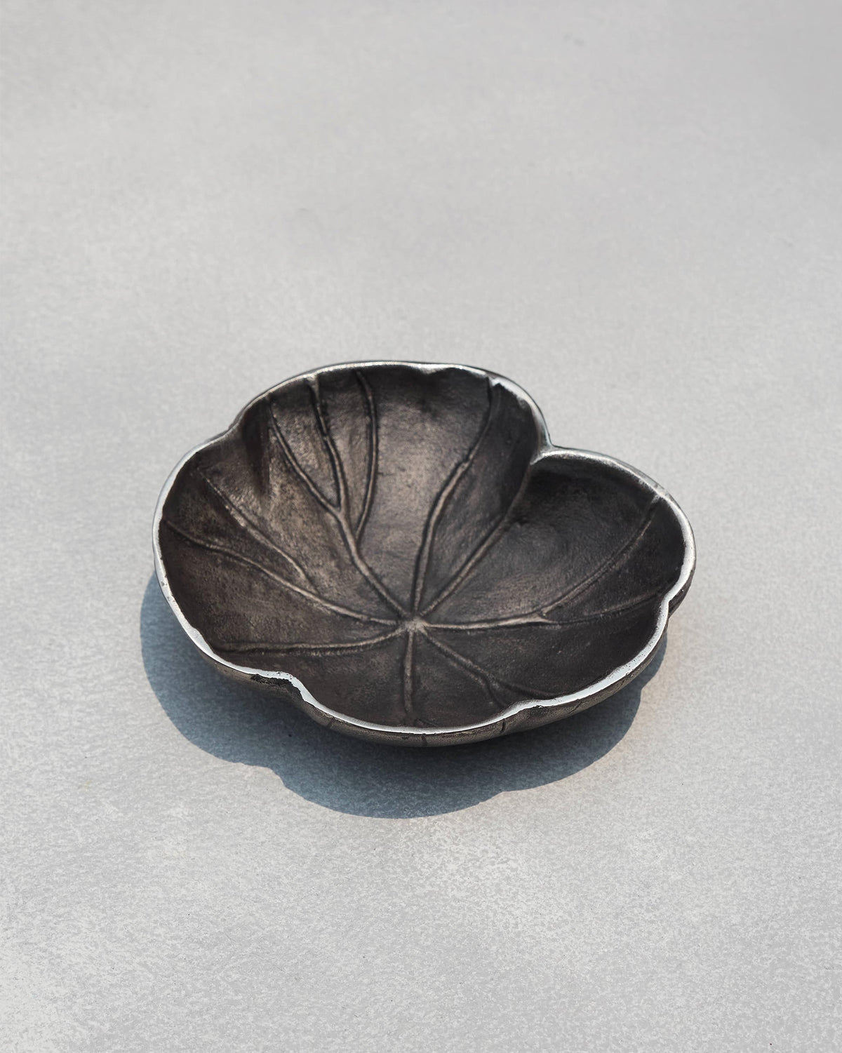 Kamal Leaf Trinket Tray with raised leaf veins and a silver rim.