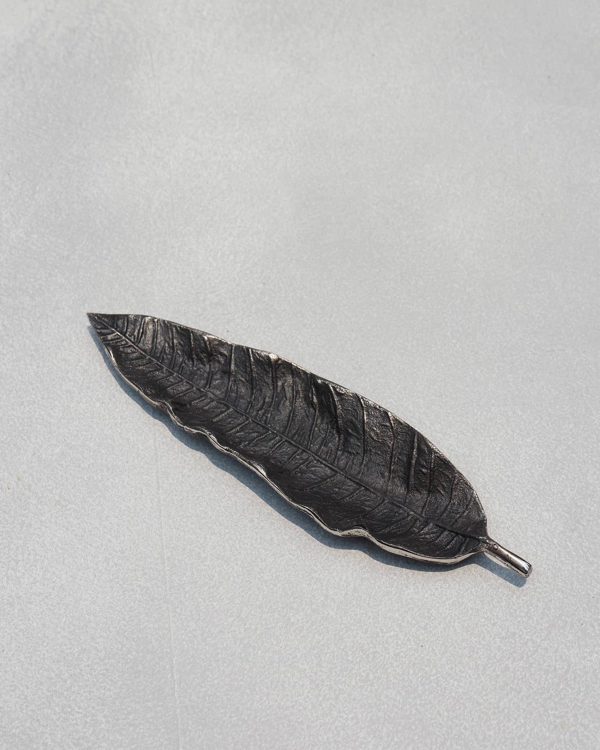 Mango leaf Incense Holder lying flat, showing its leaf veins.