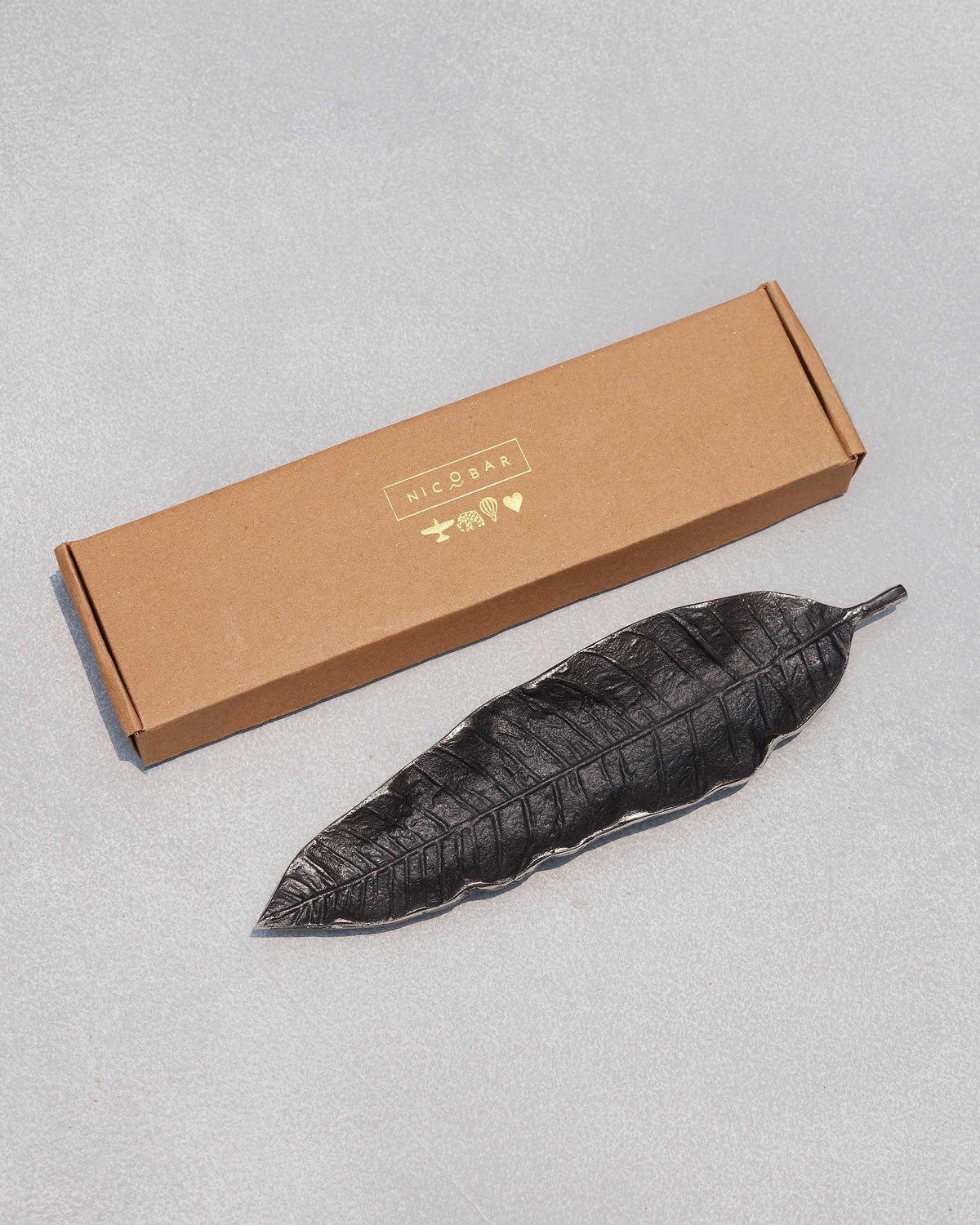 Mango leaf Incense Holder beside its branded box.