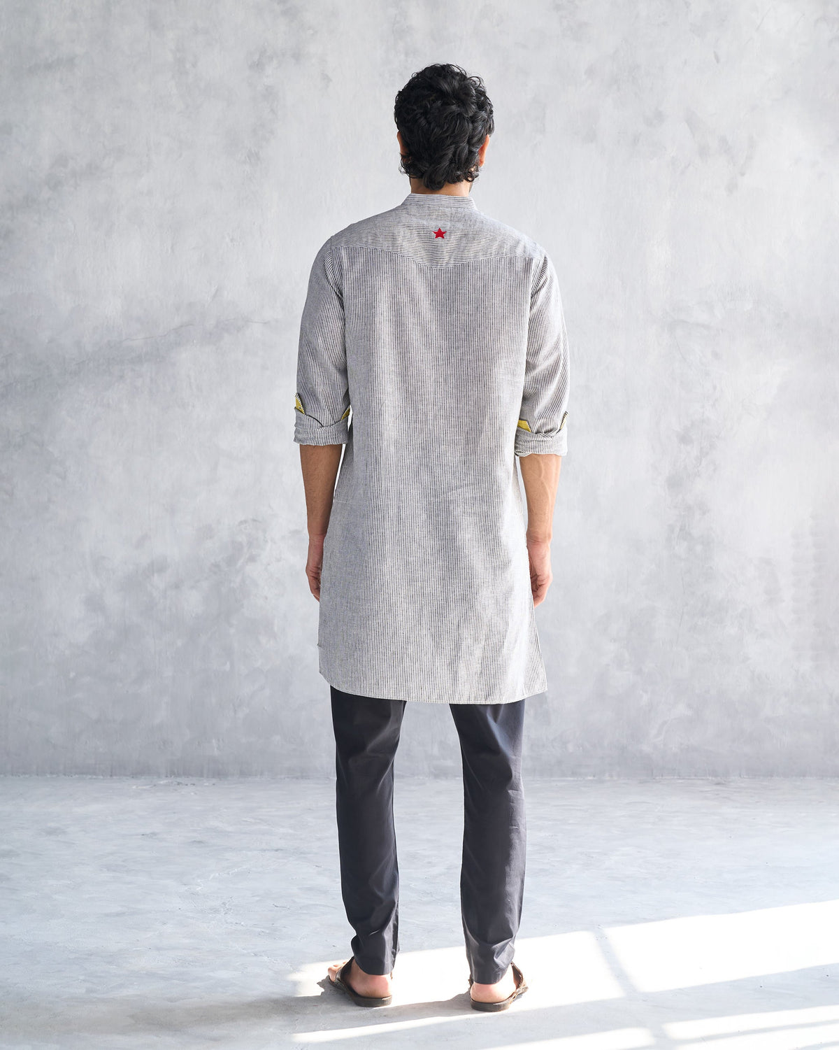 Back of the Pondicherry Kurta worn by a person, with a red star at the yoke.