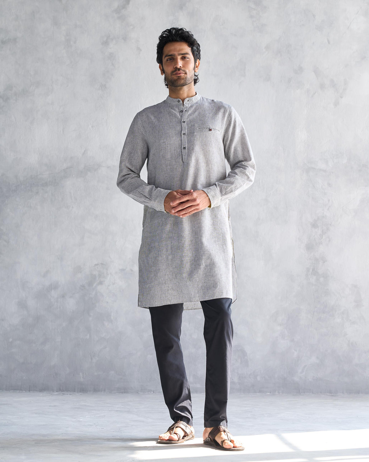 Full-length view of a person wearing the Pondicherry Kurta in charcoal stripe.