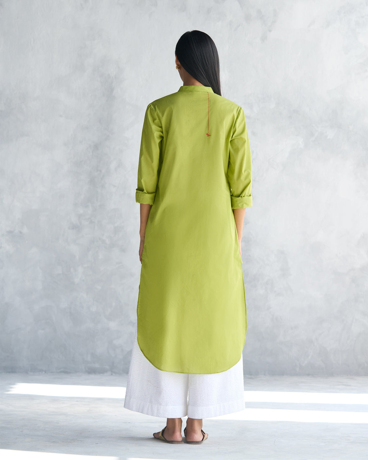 Back of the lime Basic long length kurta worn by a person.