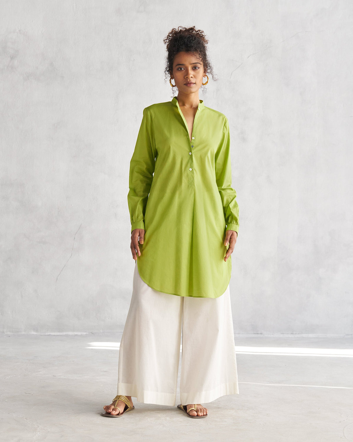 Person wearing a lime Basic Mid Length Kurta, standing full length.