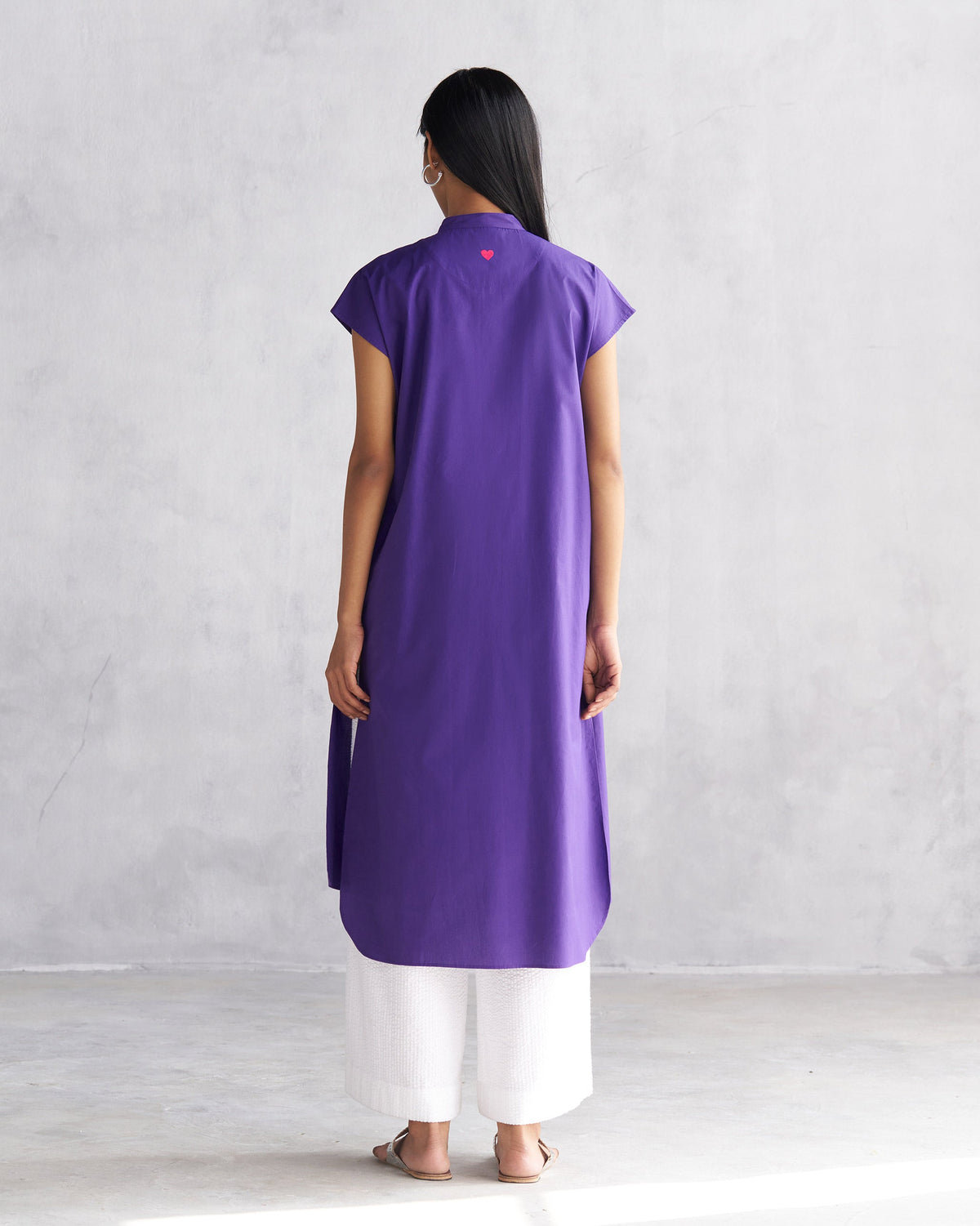Back of purple Short Sleeve Kurta worn by a person.
