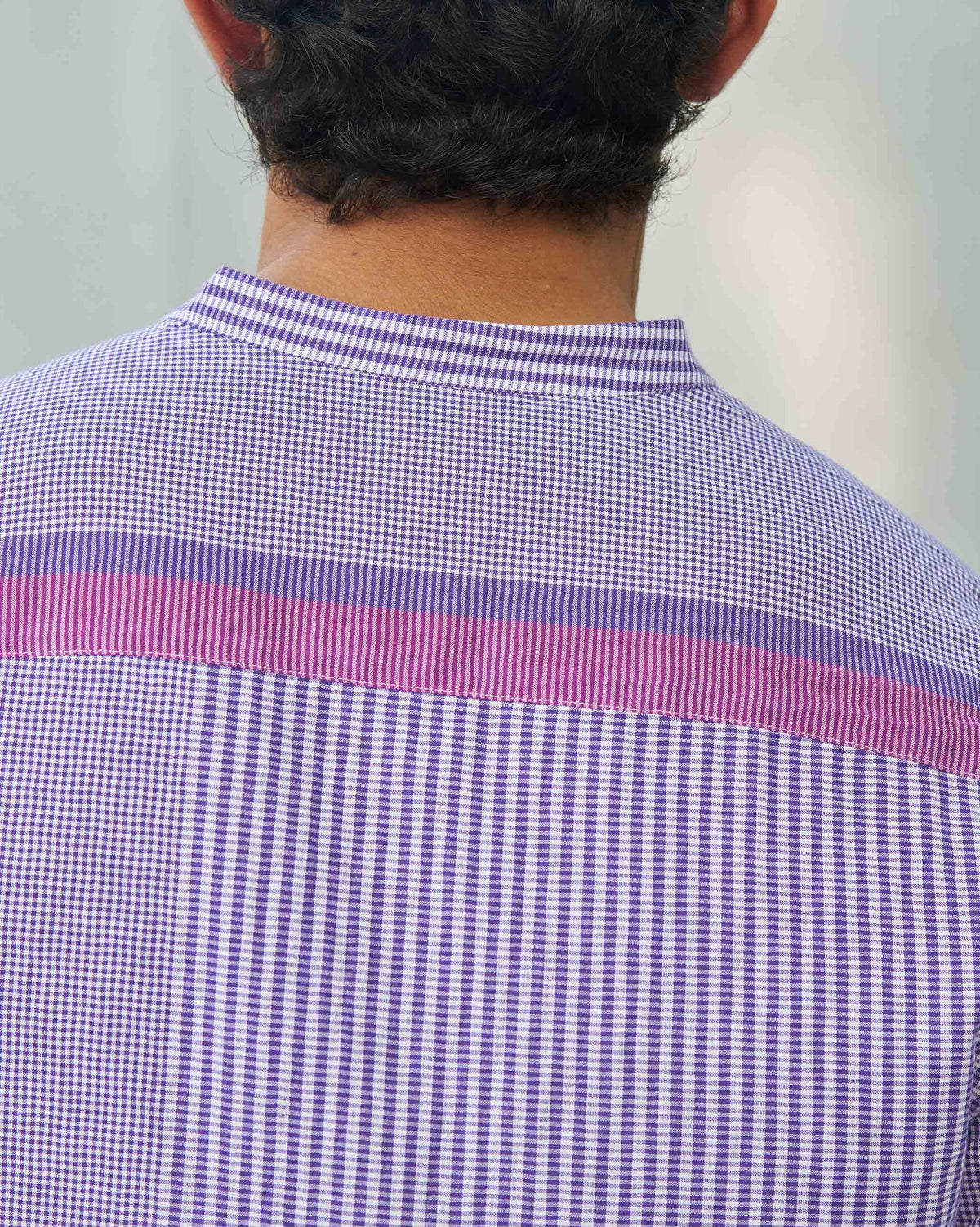 Close-up of the Summer Fridays Pocket Shirt's back showing pink and purple yoke panels.