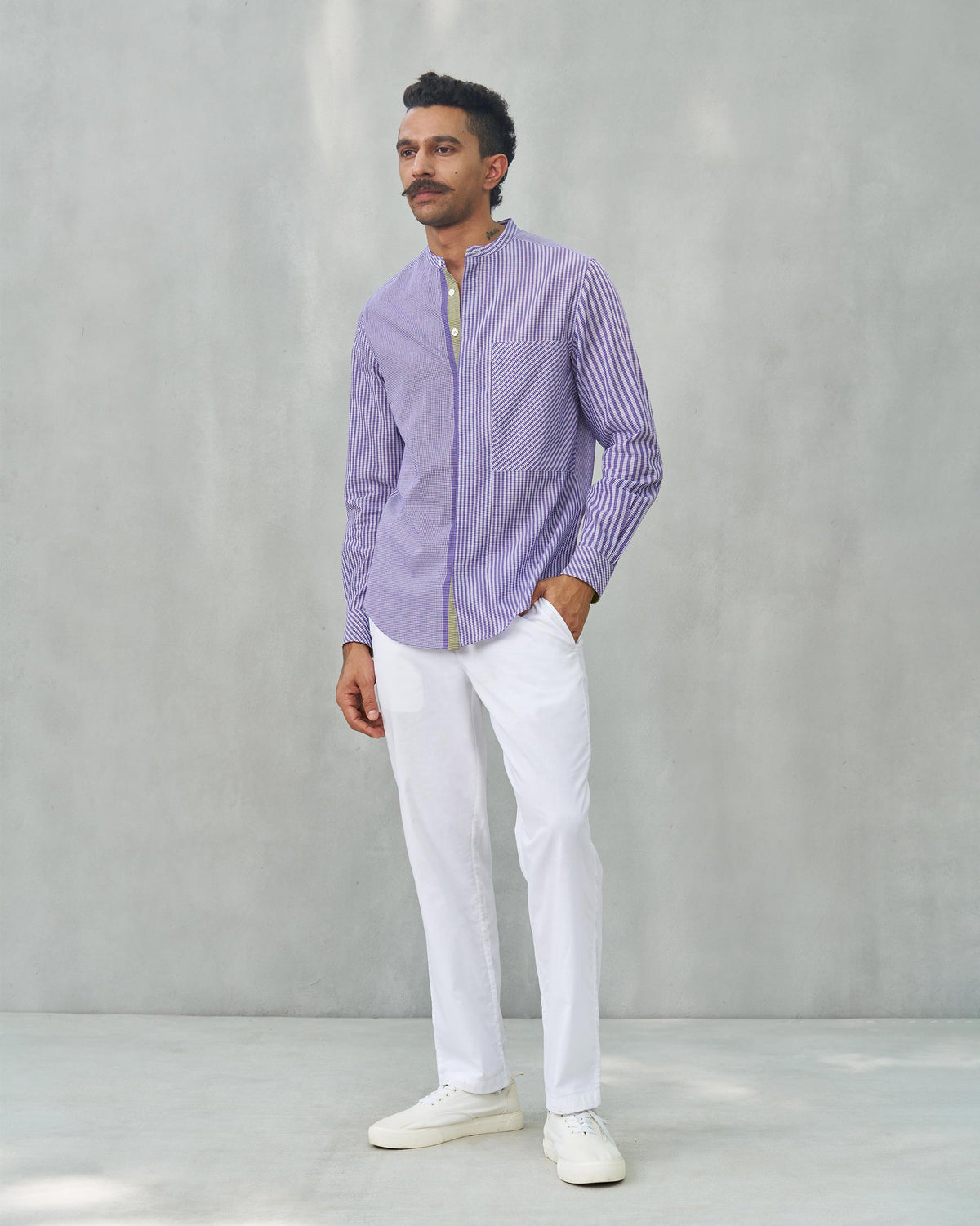 Full-length view of a purple Summer Fridays Pocket Shirt worn by a person.