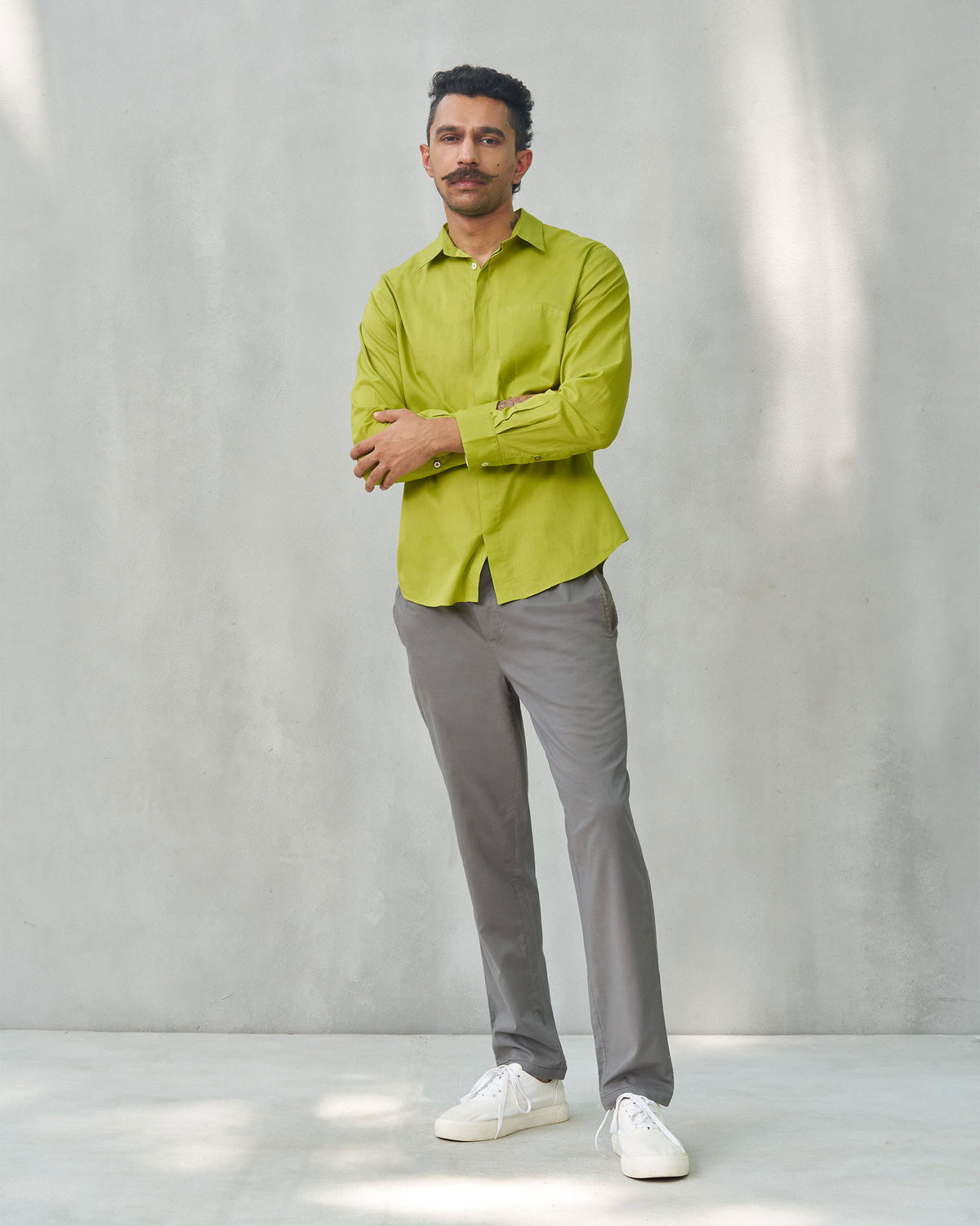 Full-length view of a person wearing the Padma Shirt in lime.