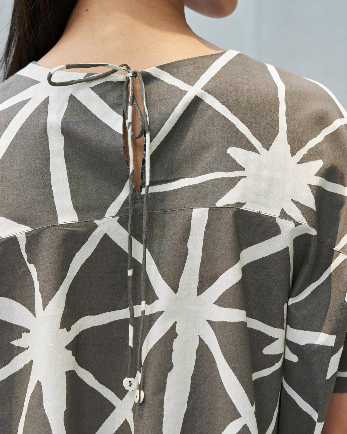 Back of a Gina top showing the tie fastening at the neckline.