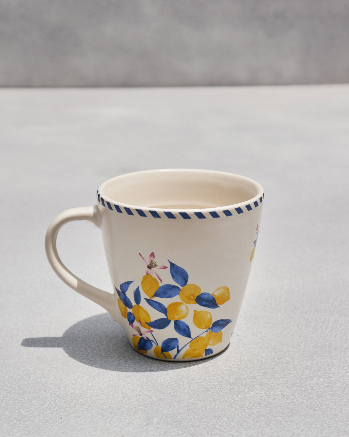 Side view of the Asfar Conical Mug showing a lemon branch motif.