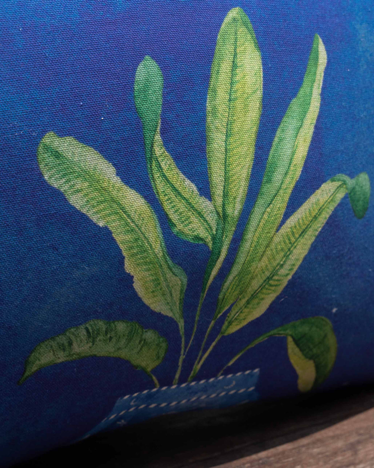 Close-up of Asfar lumbar cushion cover showing a potted leaf plant print.