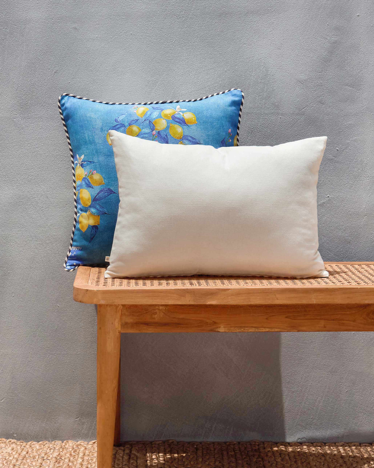 Back of Asfar lumbar cushion cover in plain cream fabric.