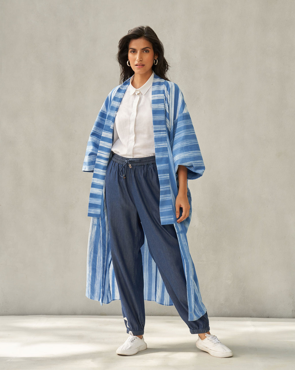 Full-length view of denim Jogger Pants worn by a person.